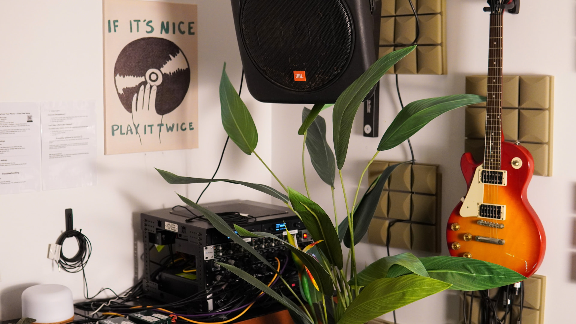The in-ear rack, guitar wall and greenery